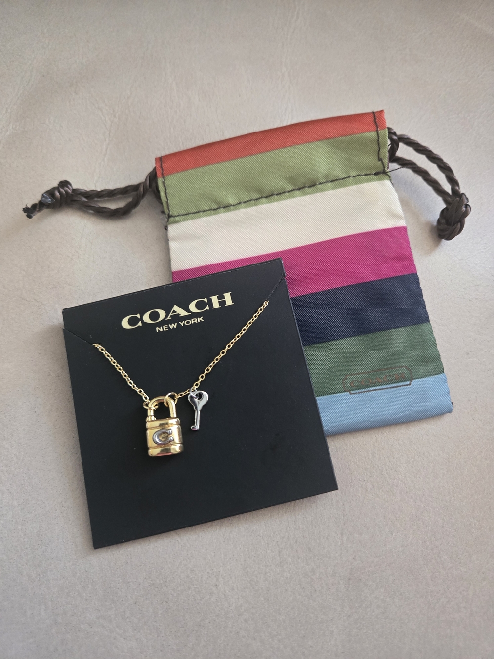 Coach Gold Padlock Necklace with Key Charm and Coach Jewelry Dust Bag Pouch